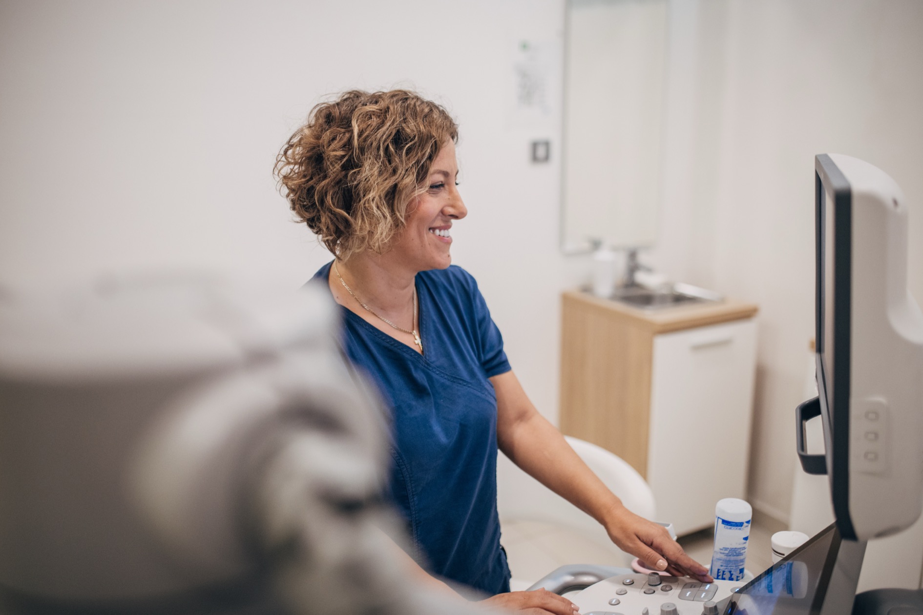 Sonography professional performing ultrasound